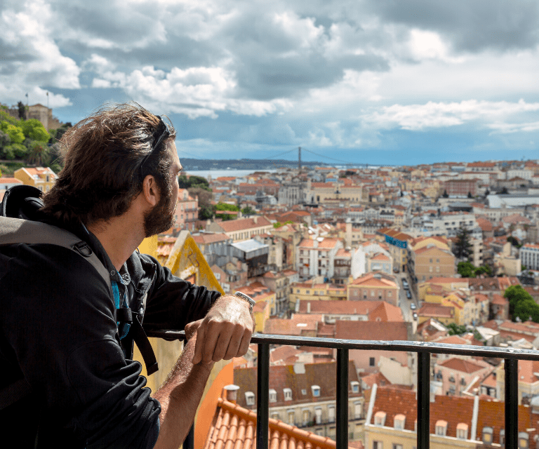 A man admiring the view over Lisbon from above