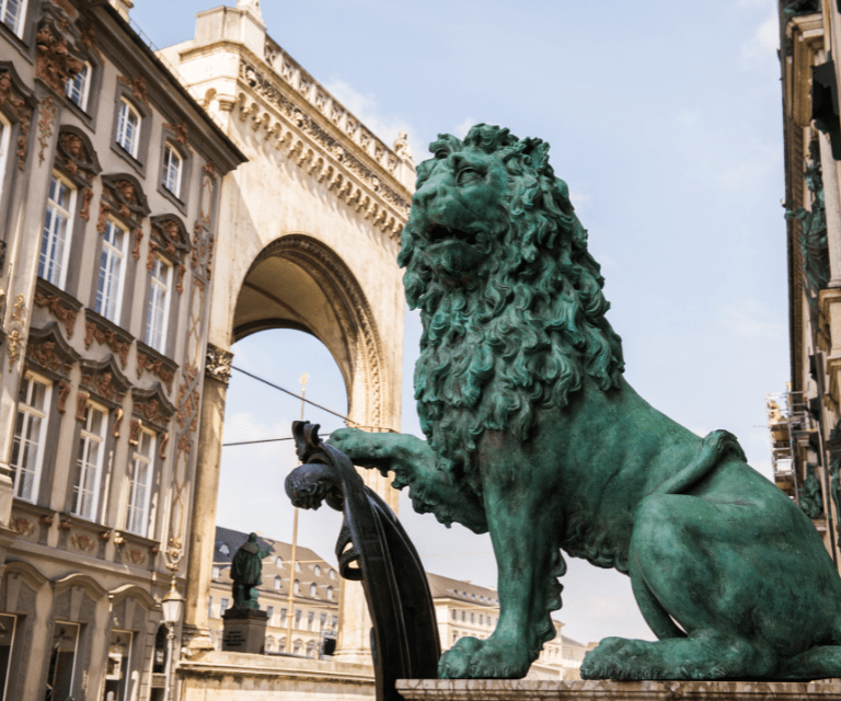 A statue of lion near the Residenz palace, a must-visit place on a Munich city break