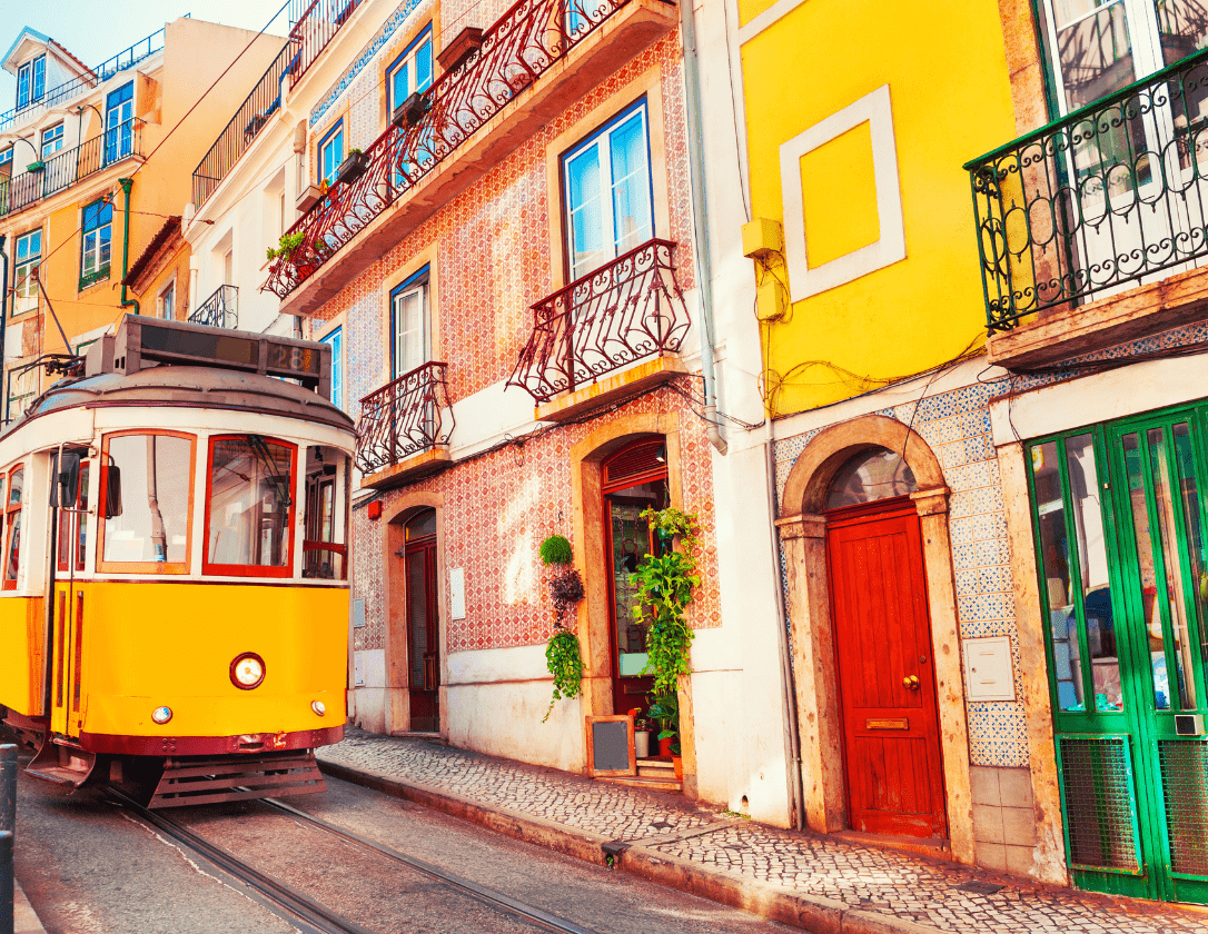 Yellow vintage tram on the street in Lisbon, one of the must-see things on lisbon city break