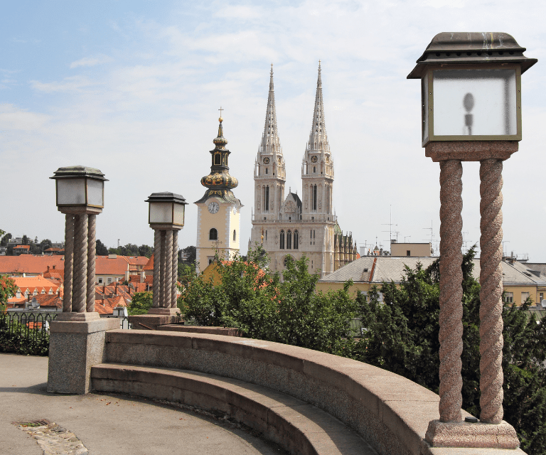 A photo Zagreb Cathedral, one of the must-see sights during a Zagreb city break taken from a nearby bridge