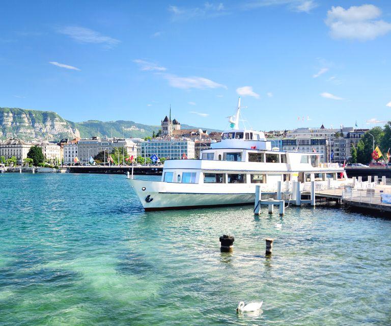A luxury yacht on a Lake Geneva, the eponymous city is visible on the background. Enjoying a boat ride is a must-do activity on a weekend break to Geneva