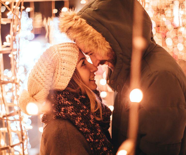 A couple on a Christmas market, enjoying their christmas break to Geneva