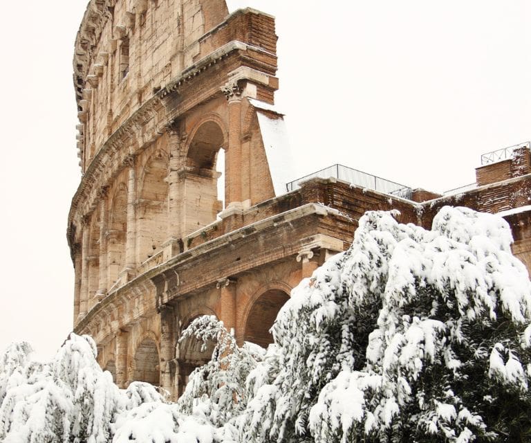 The colosseum covered in snow