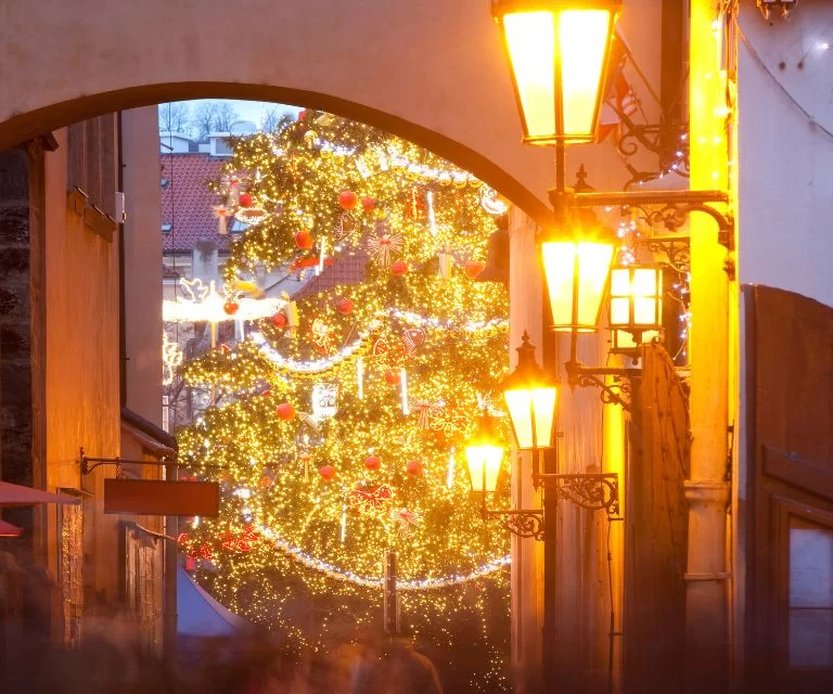 A beautifully illuminated alley leading to the Christmas tree on the Old Town square in prague, a muct visit sight during a Christmas break to Prague