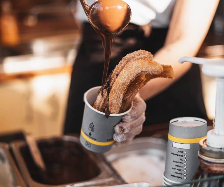 Churros with chocolate. a must-try dish during a getaway to Madrid