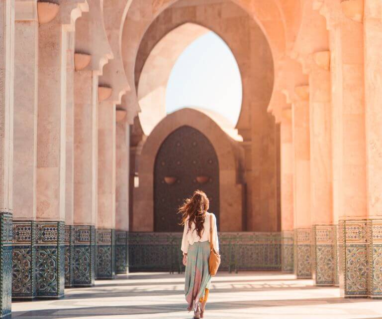 A woman exploring an ancient mosque during a Morocco weekend break