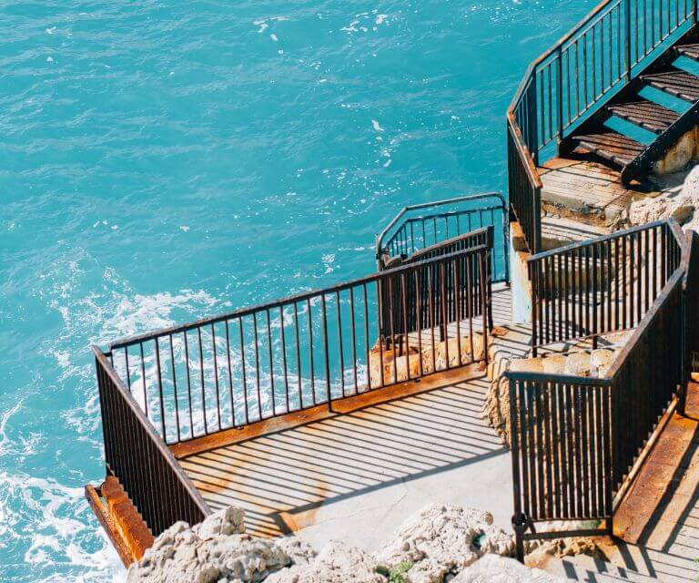 Railing near the sea at the quai of rubeu cape, a must-visit place on a city break to Nice