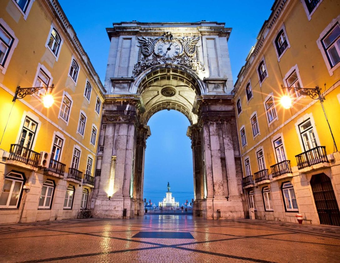 Gate at the street to Praca do Comercio at evening, a beautiful sight you don't waте to miss on the luxury break to Lisbon.