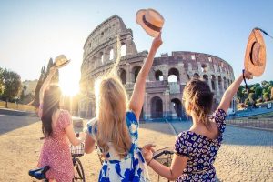 3 women near Colloseum on their long weekend break to Rome