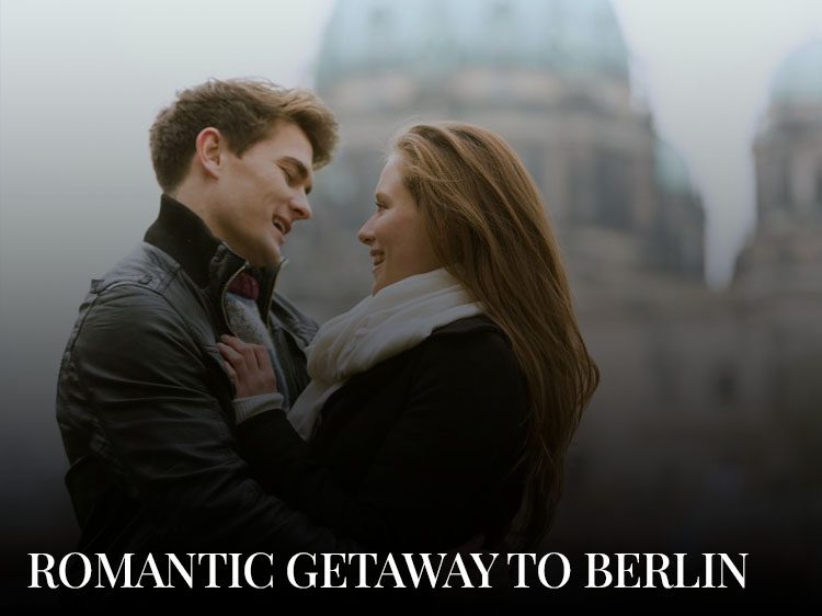 A young couple embracing each other near the Berlin Cathedral during their romantic getaway to Berlin