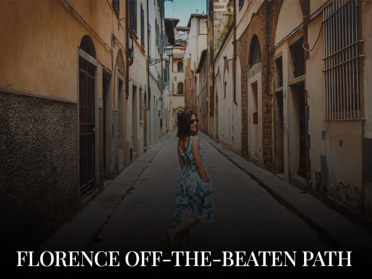 A woman in a beautiful dress exploring the city during her off-the-beaten-path Florence getaway
