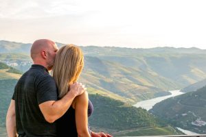 A couple enjoying the views over the Douro Valley during a romantic weekend break to Porto