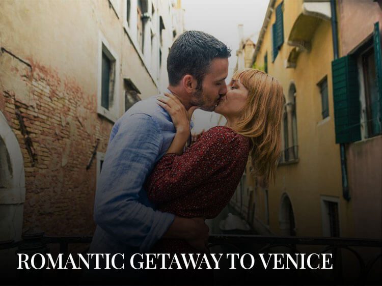 A couple kissing on a bridge, enjoying their romantic getaway to Venice